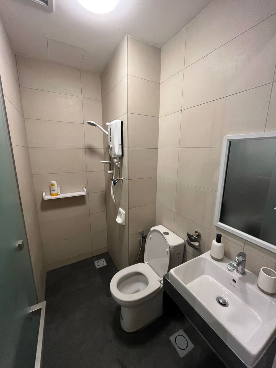 Clean bathroom with shower, toilet and basin